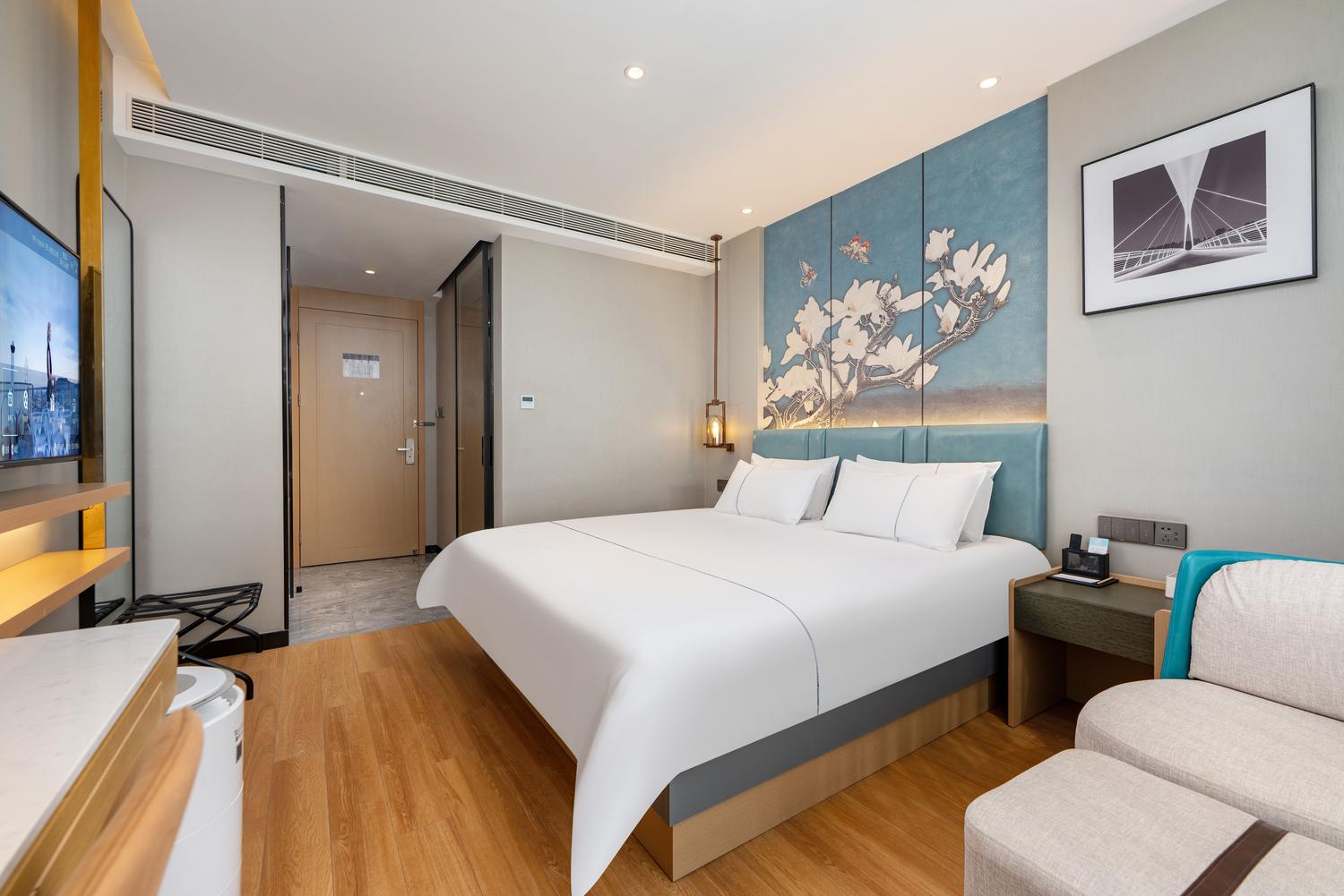 Magnotel Hotel (Huantai Xinyulou) - Tap to explore photos