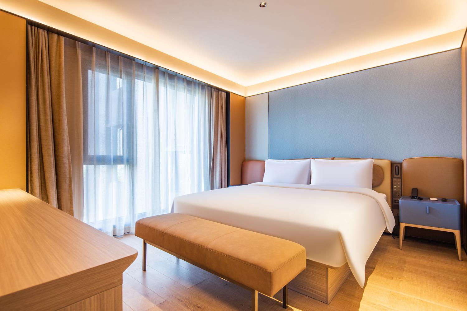 Orange Hotel (Xinyang Gushi Branch) - Tap to explore photos